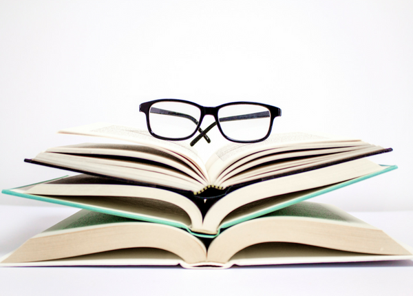 glasses on a pile of books