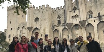 students in front of castle at Arles